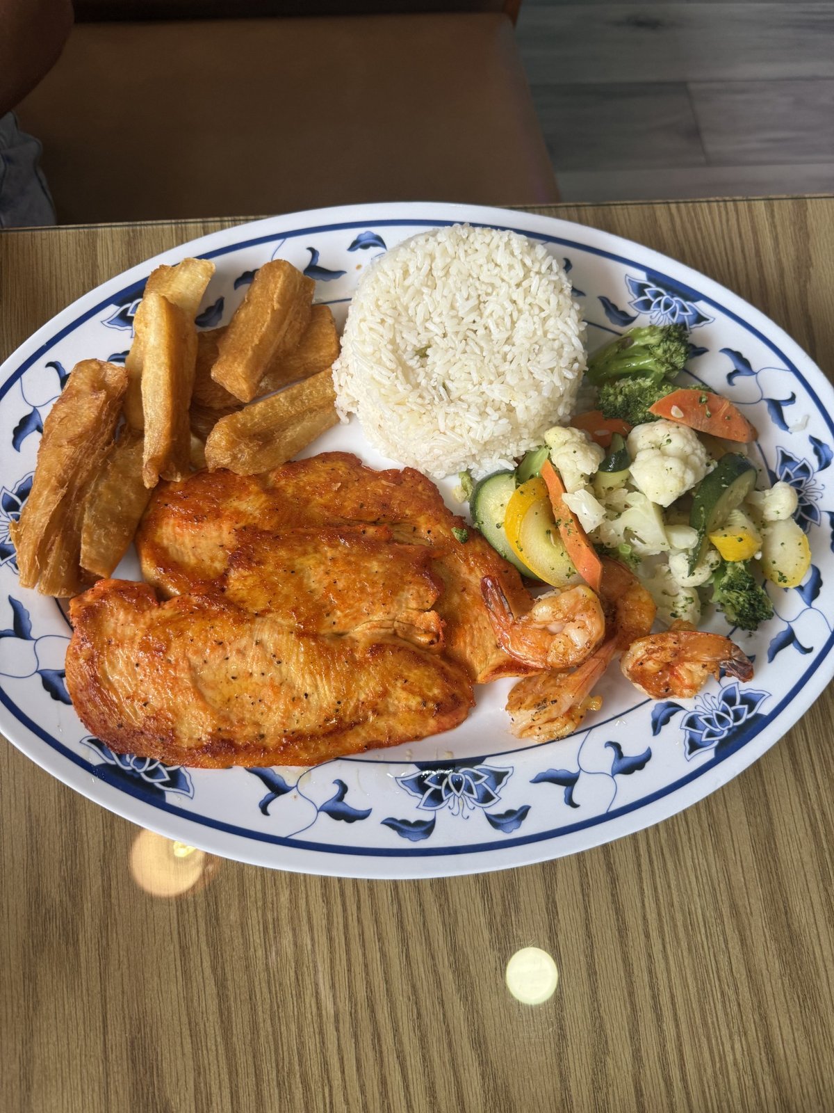 Brianna Platter with grilled chicken, shrimp, rice, and fries at El Rinconcito Latino